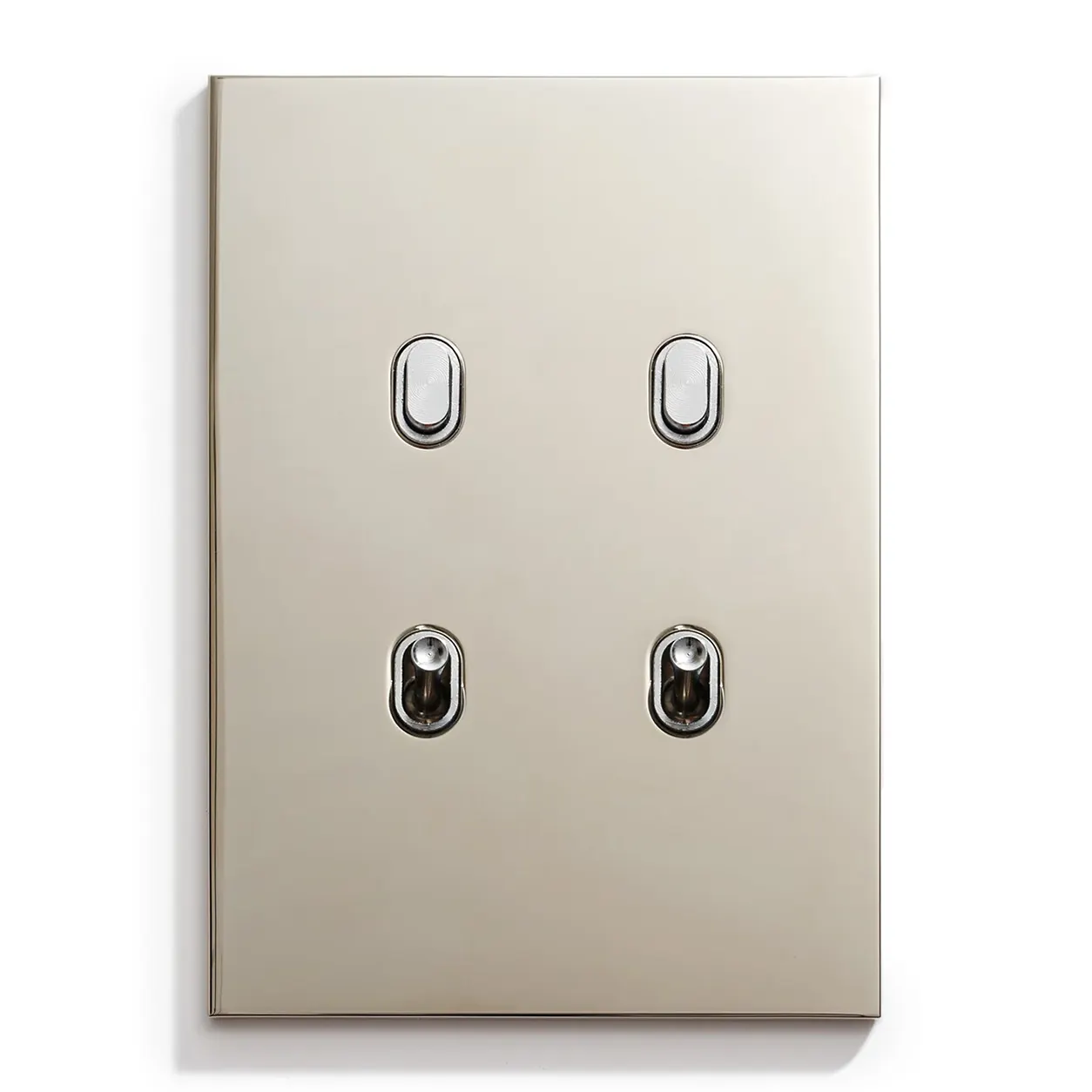 Beige 4-gang metal wall plate with four small rocker switches arranged in a 2x2 grid (two on top, two on bottom).