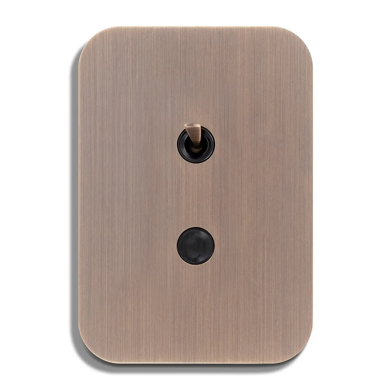 Brushed bronze wall plate with rounded corners, featuring a vertical toggle switch above a round black push button.