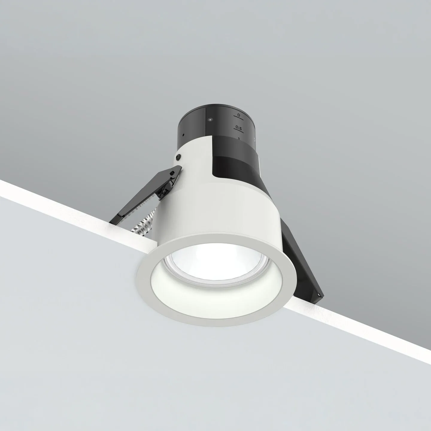 Adjustable ceiling track light fixture with a round white housing and frosted LED bulb