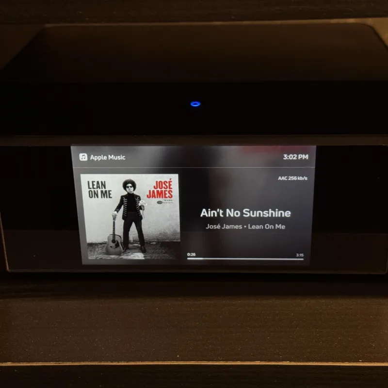 Malibu Wired showroom player displaying Apple Music playback and AAC 256 kb/s
